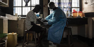 A patient has blood drawn for an Ebola test at a health center in the Democratic Republic of the Congo.