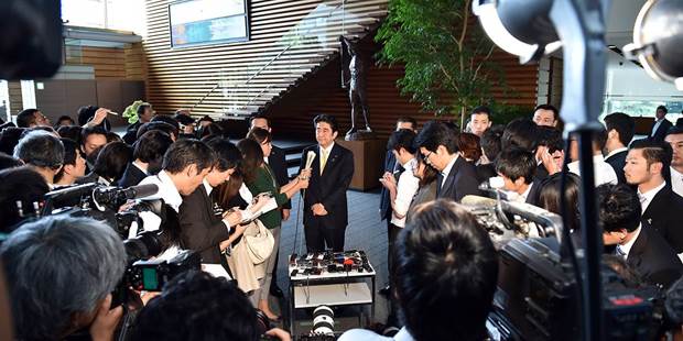 Japanese Prime Minister Shinzo Abe answers questions during a short press interview 