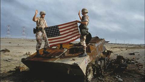 US soldiers take oath to the US army on an Iraqi destroyed tank in Iraq