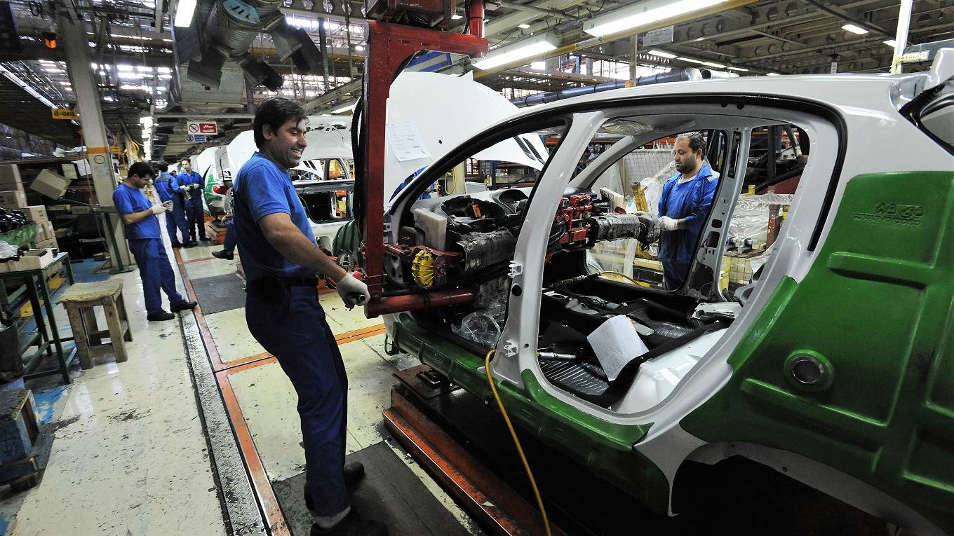 Workers at the Iranian Khodro car manufacturing plant make Iranian car models