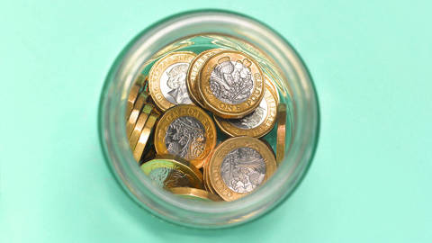 ekue1_Peter DazeleyGettyImages_green_jar_coins