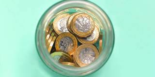 ekue1_Peter DazeleyGettyImages_green_jar_coins