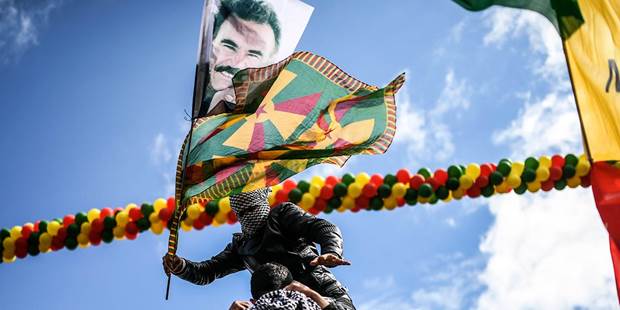 Boy with a Kurdish flag