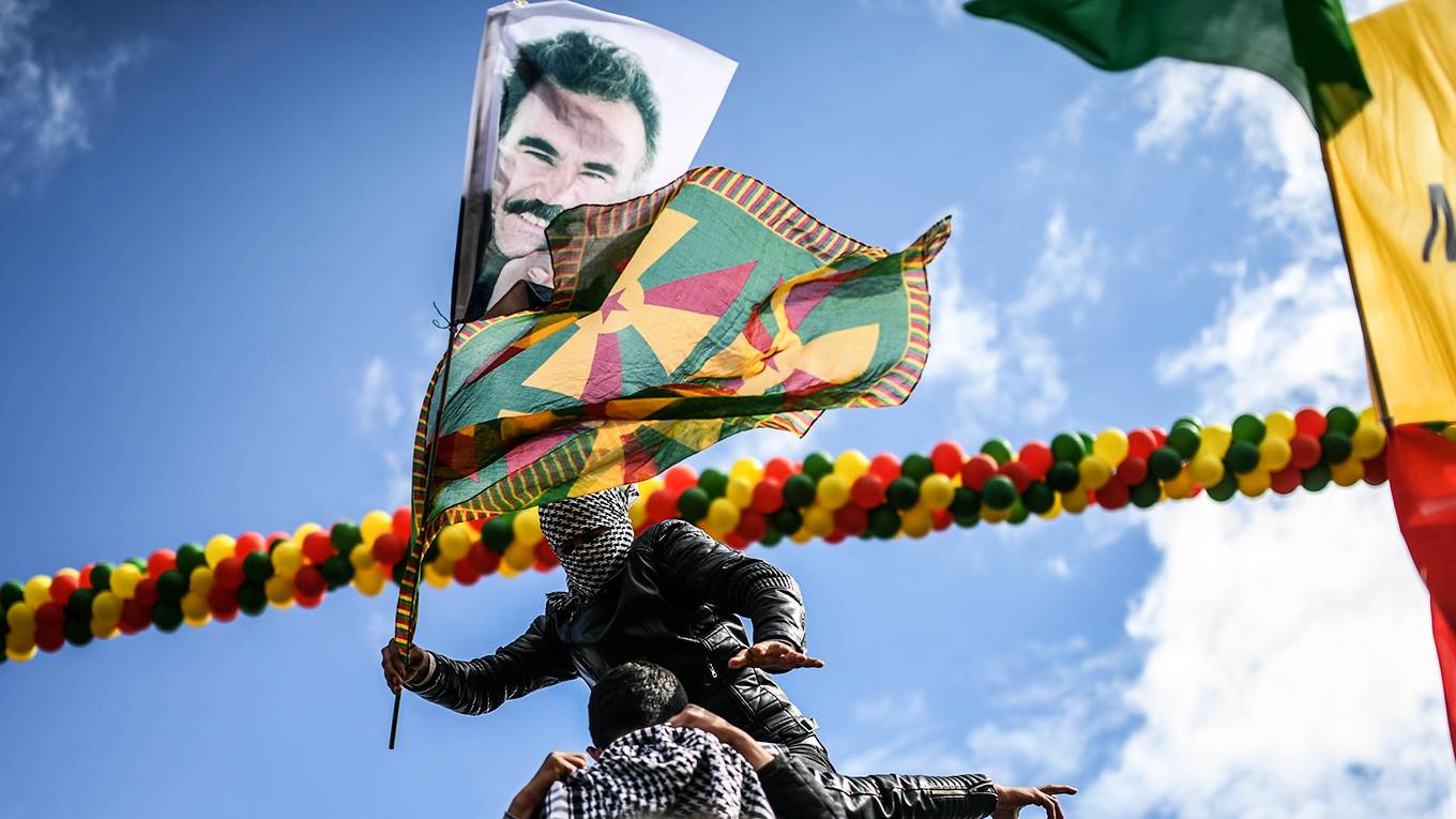 Boy with a Kurdish flag