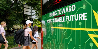 People walk by a new electric bus in Krakow.
