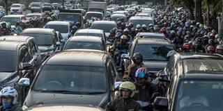Commuters wait in a traffic jam during afternoon rush hour in Jakarta 