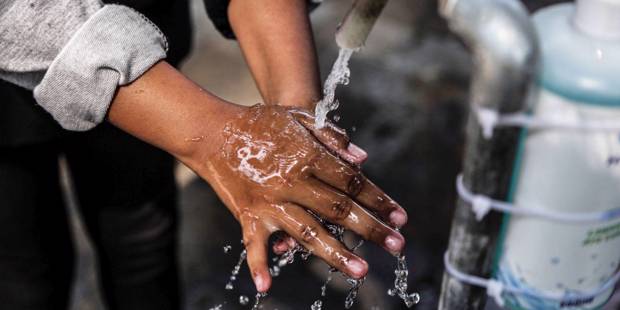 dupas1_Aditya SaputraINA Photo AgencyUniversal Images Group via Getty Images_hand washing covid