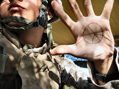 Soldier peace sign