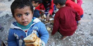 Refugees kids eat bread