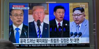 A screen showing images of South Korea's president Moon Jae-in, US president Donald Trump, China's president Xi Jinping, and North Korea's leader Kim Jong Un 