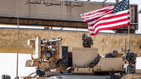 haass108_DELIL SOULEIMANAFP via Getty Images_USflagsoldiersyria