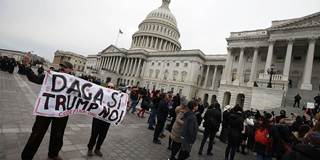 People who call themselves Dreamers protest in front of the Senate side of the US Capitol
