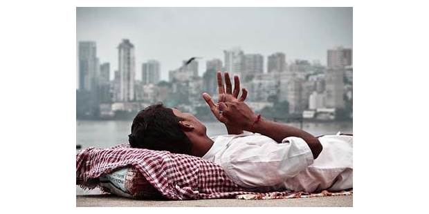 India boy looking at Mumbai