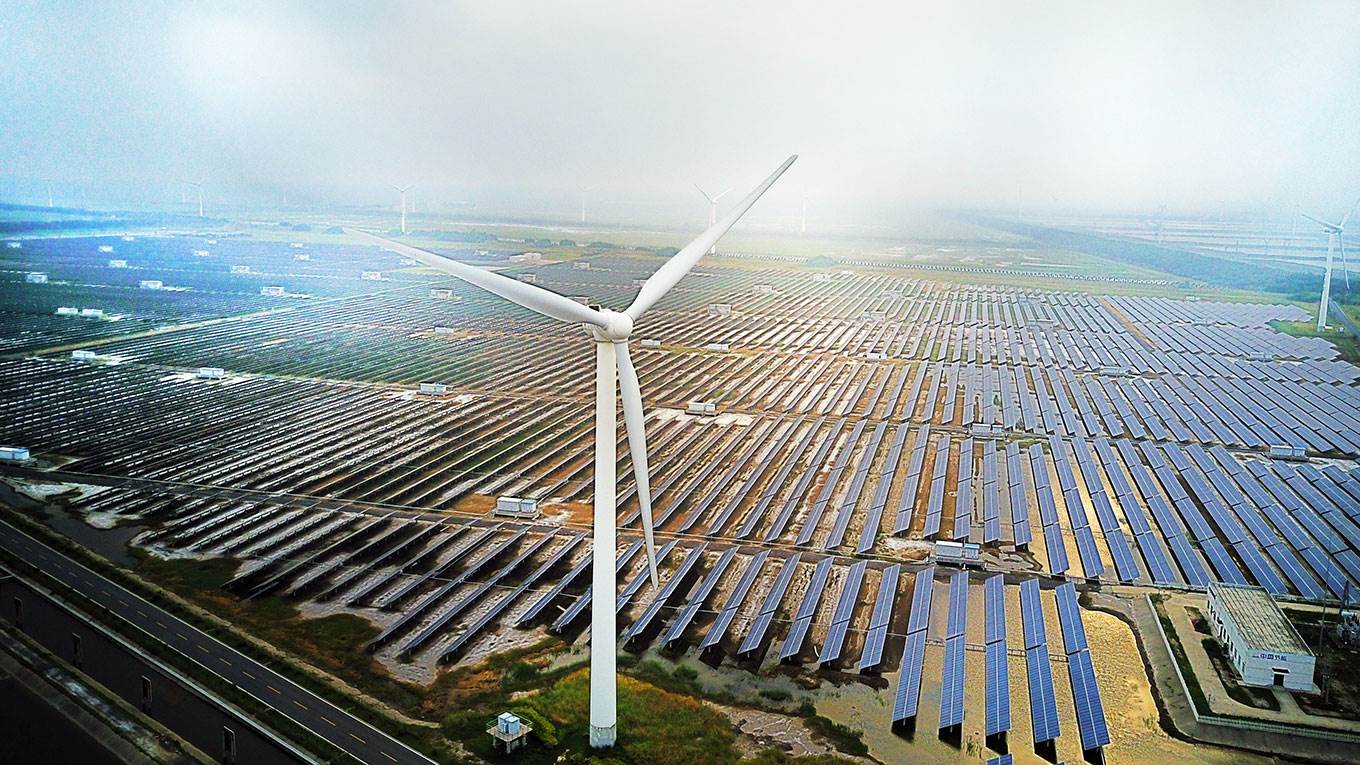 An industrial base consisting of wind turbines and solar panels