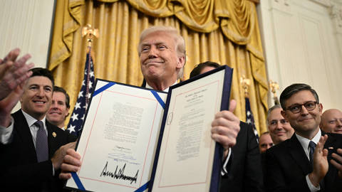 johnson187_Brendan SmialowskiAFPGettyImages_trump_signs_genius_act
