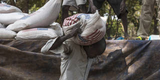 fofack31_Fred DufourGettyImages_usaid_bag_car