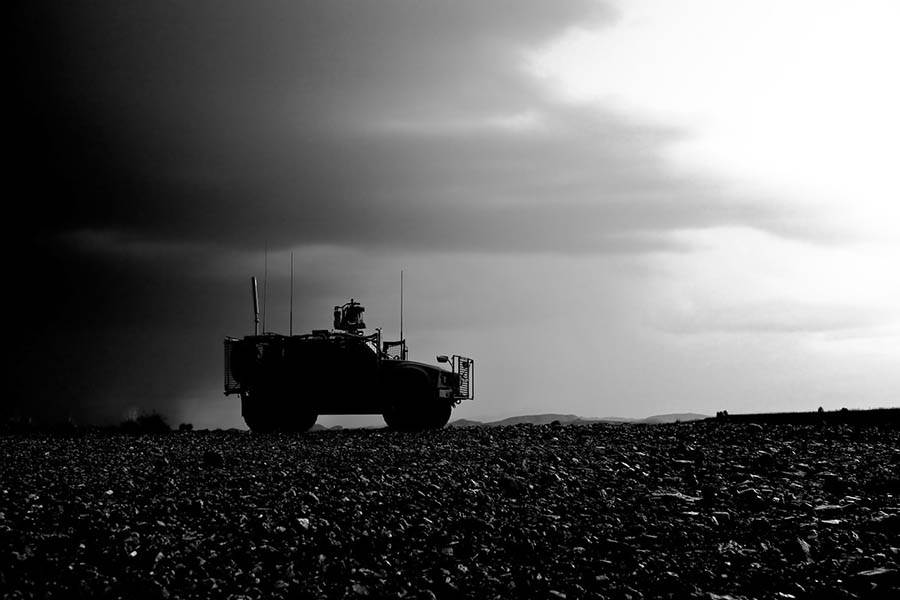 Army vehicle isolated in the desert.