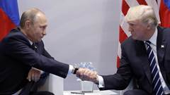  Russia's President Vladimir Putin and US President Donald Trump shake hands