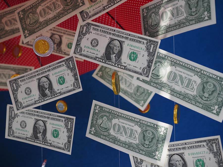 United States dollar and euro coins hanging