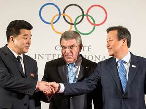 IOC President Thomas Bach stands with Mr. Kim Il Guk, DPR Korea, and Mr. Jong Whan Do, South Korea