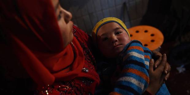 yi3_ GREG BAKERAFP via Getty Images_uyghur birth rate