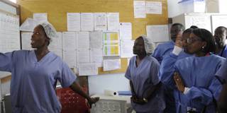 sirleaf7_ ZOOM DOSSOAFP via Getty Images_nurse liberia