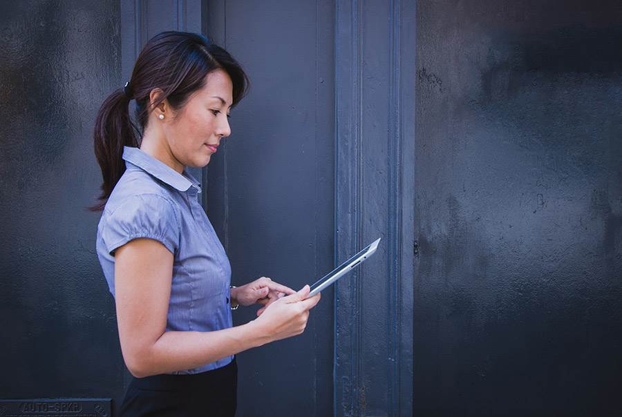 Professional woman working on tablet.