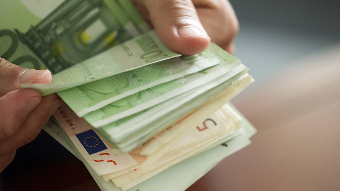 pisaniferry107_PHotoAltoFrederic CirouGetty Images_eurocashhands