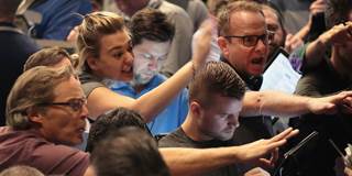 Traders signal offers in the S&P options pit at the Cboe Global Markets, Inc. exchange 