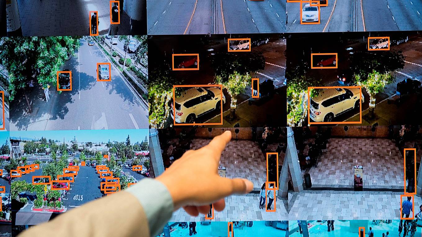 A display shows a vehicle and person recognition system for law enforcement