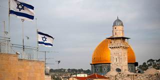 Israeli flags fly near the Dome of the Rock in the Al-Aqsa mosque compound 