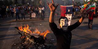 velasco98_CLAUDIO REYESAFP via Getty Images_santiagoprotestmaskfire