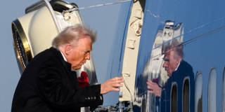 Former U.S. President Donald Trump boards Air Force One at Detroit Metropolitan Wayne County Airport in Romulus, Michigan, on January 13, 2026, after speaking at The Detroit Economic Club and visiting a Ford production plant.
