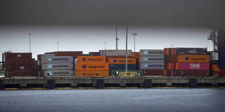 Shipping containers stacked at a New York–area port amid rising U.S.–China trade tensions.