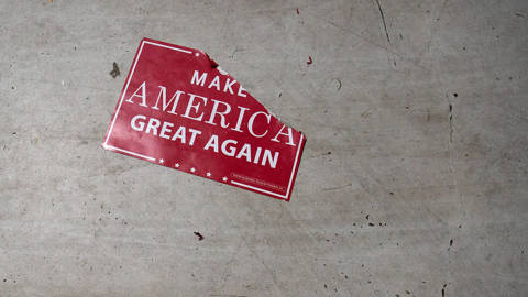MAGA poster on the floor.
