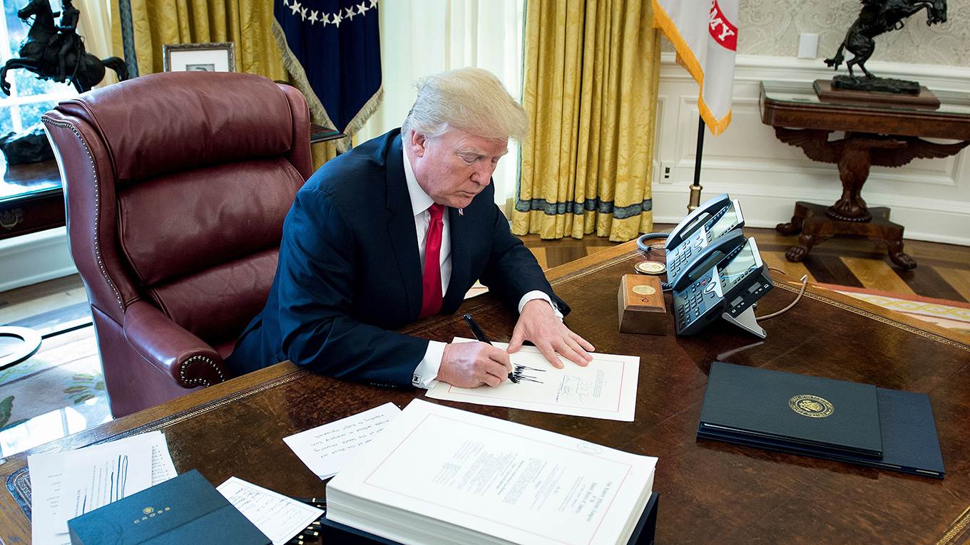 Donald Trump signs the Tax Cut and Reform Bill