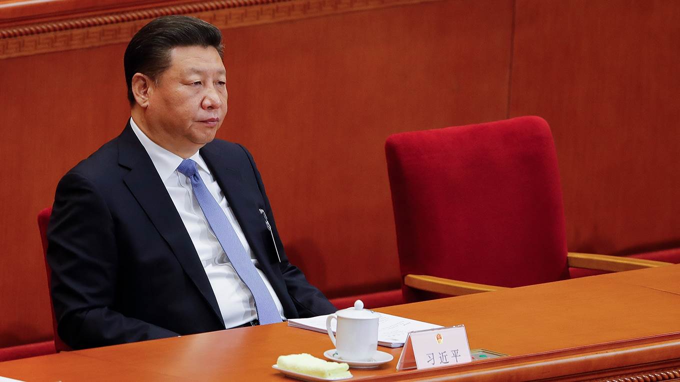 Chinese President Xi Jinping attends the opening session of the National People's Congress