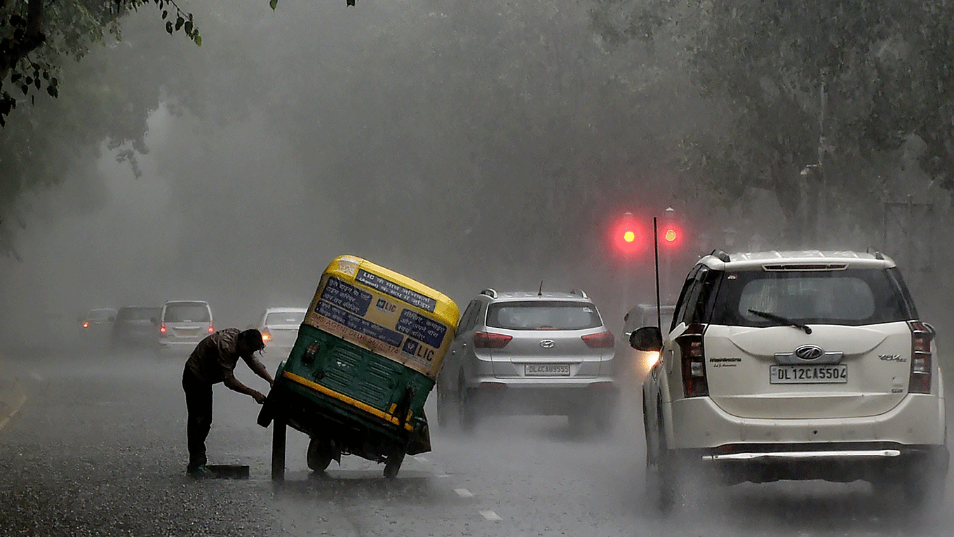 An Indian auto rickshaw driver