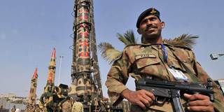 Pakistani Army soldiers guard nuclear-capable missiles