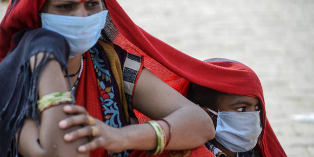 ghosh54_SAJJAD HUSSAINAFP via Getty Images_india covid poverty