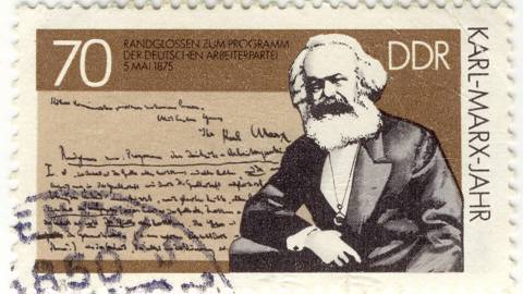 Vintage stamp with German creator of communism Karl Marx