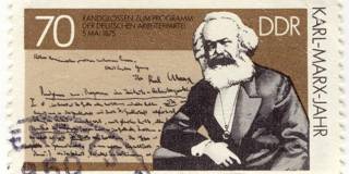 Vintage stamp with German creator of communism Karl Marx