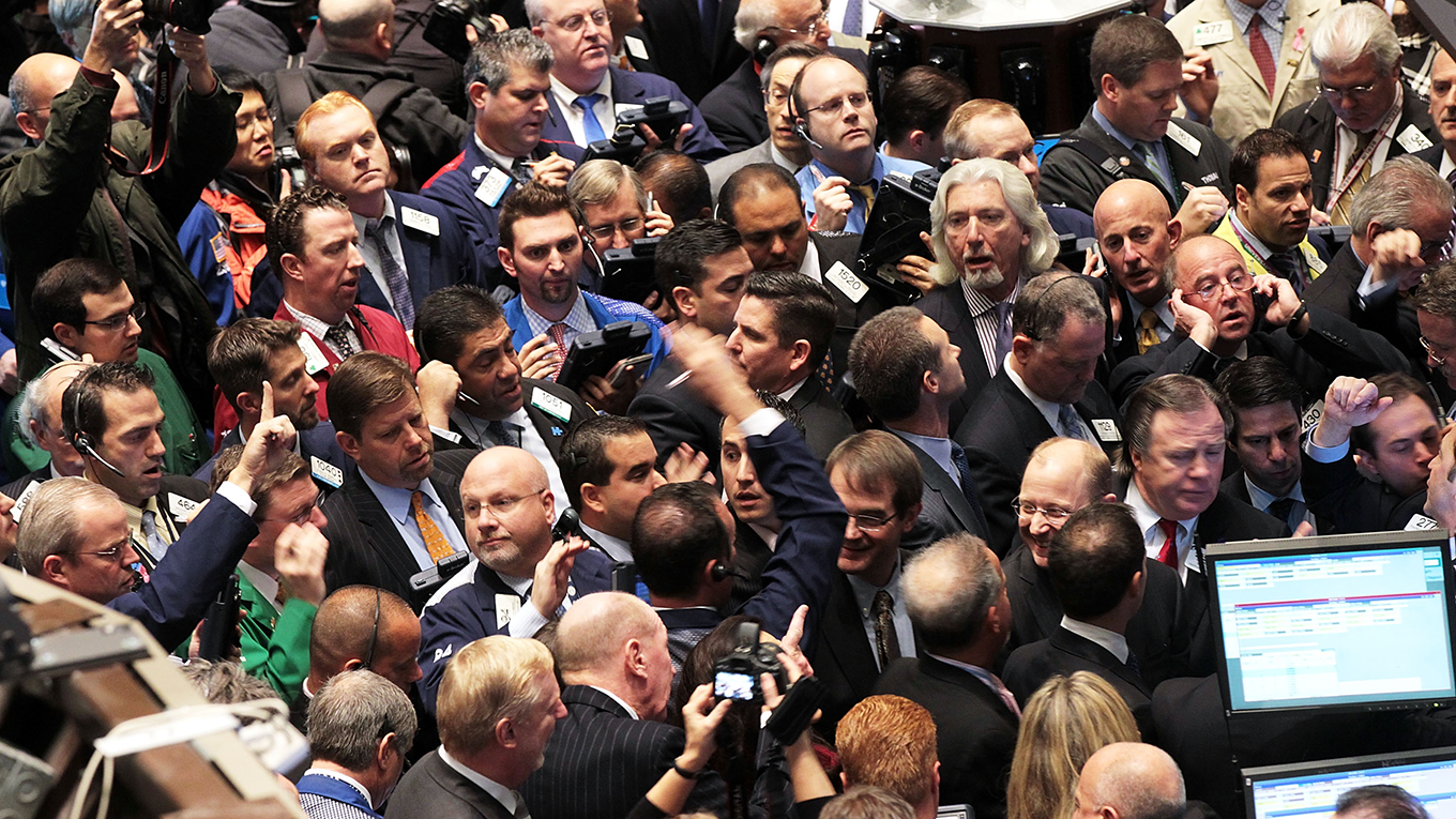 Traders crowd at NYSE
