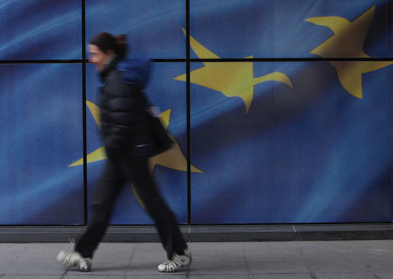 woman walking eu flag