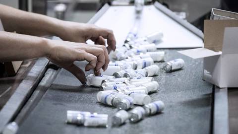An employee at work at a packing line of the Biokhimik plant manufacturing antibiotics