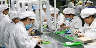 Chinese employees working on micro and special motors for mobile phones 