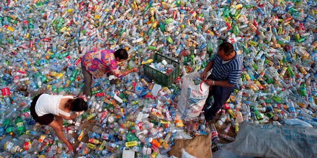 Chinese sort waste plastic bottles for recycling