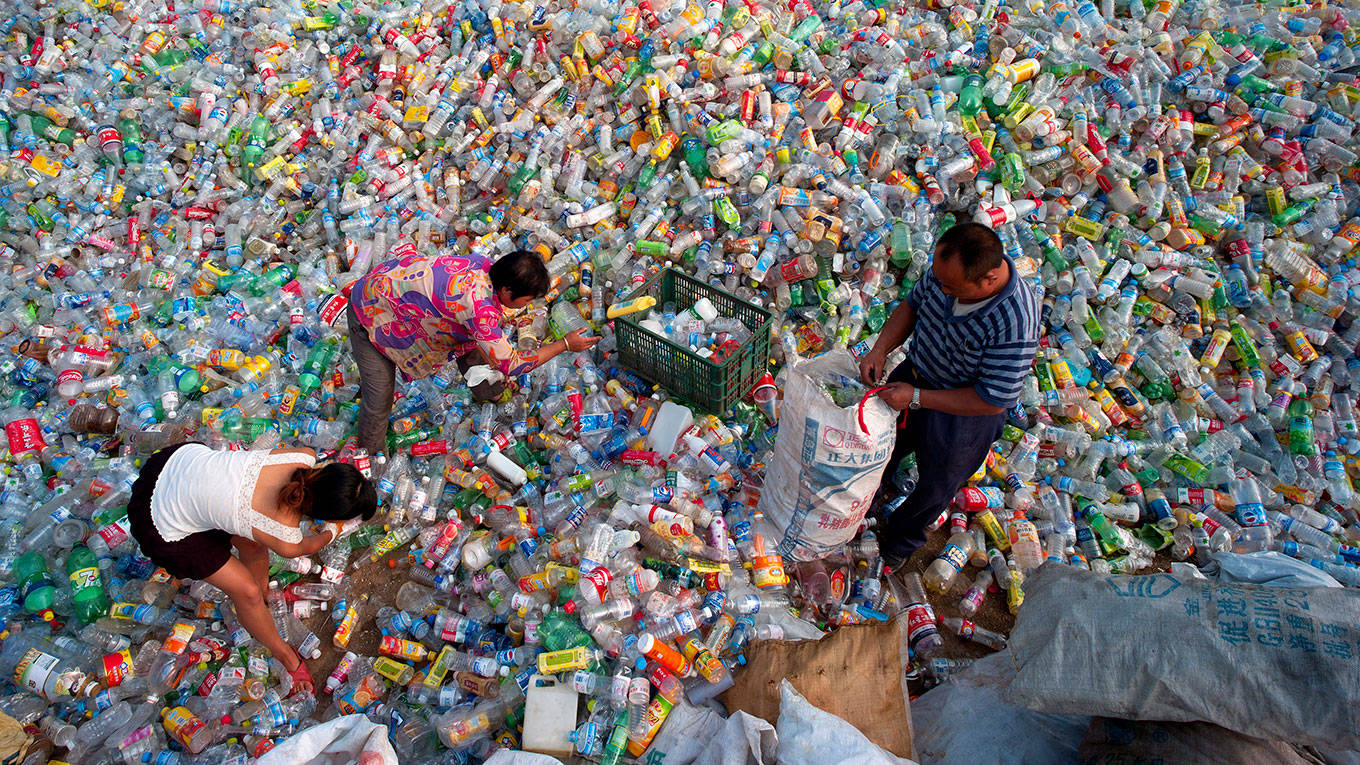 Chinese sort waste plastic bottles for recycling