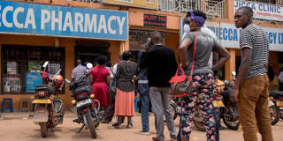 monga6_BADRU KATUMBAAFP via Getty Images_africaugandapharmacylinecoronavirus