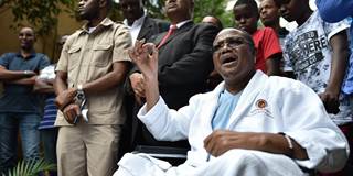 Tanzanian main opposition chief Tundu Lissu gestures from his wheelchair